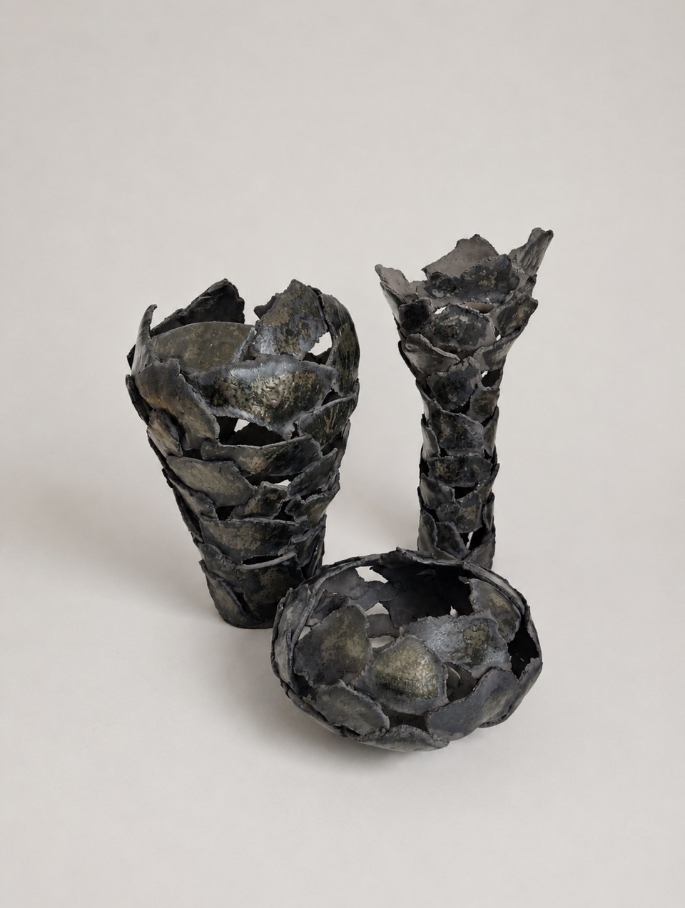 Set of Ceramic vases with an open fragmented silhouette, Aventurine glaze